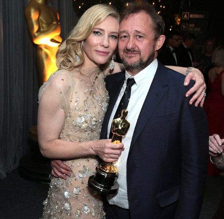 Cate Blanchett and her husband, Andrew Upton posing for a photo shoot.
